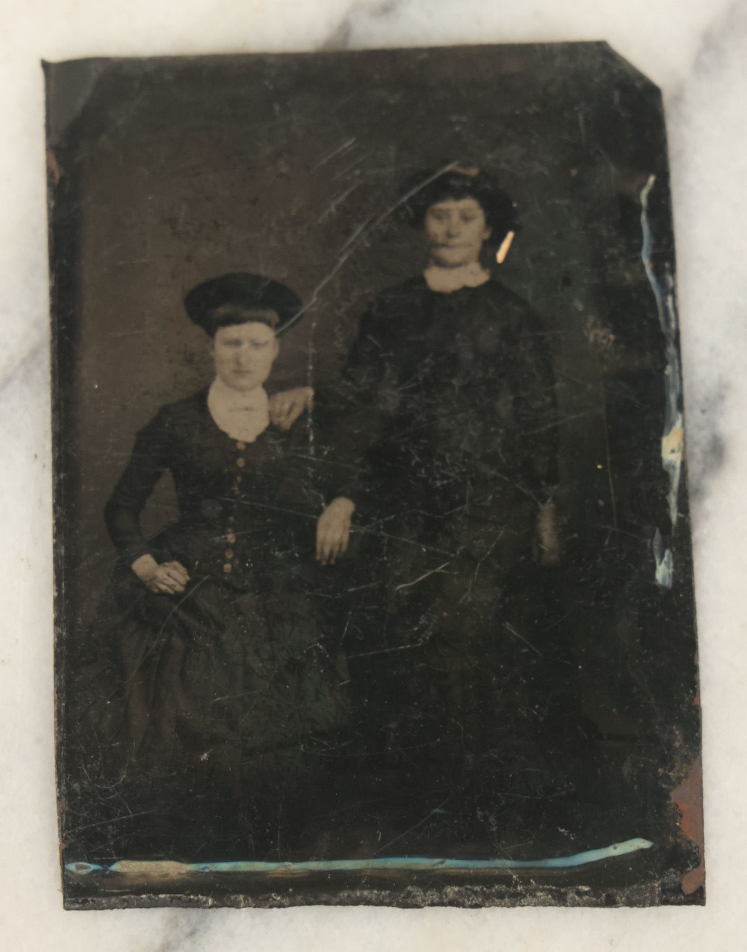 Lot 094 - Grouping Of Ten Tintypes Of Men, Women, And Children, Including Old Man With Beard, Man With Watch Chain, Boy Standing At Table, Others, Four With Paper Frames