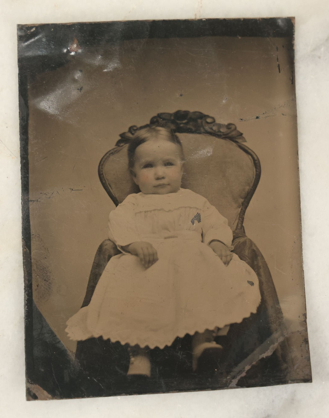 Lot 094 - Grouping Of Ten Tintypes Of Men, Women, And Children, Including Old Man With Beard, Man With Watch Chain, Boy Standing At Table, Others, Four With Paper Frames