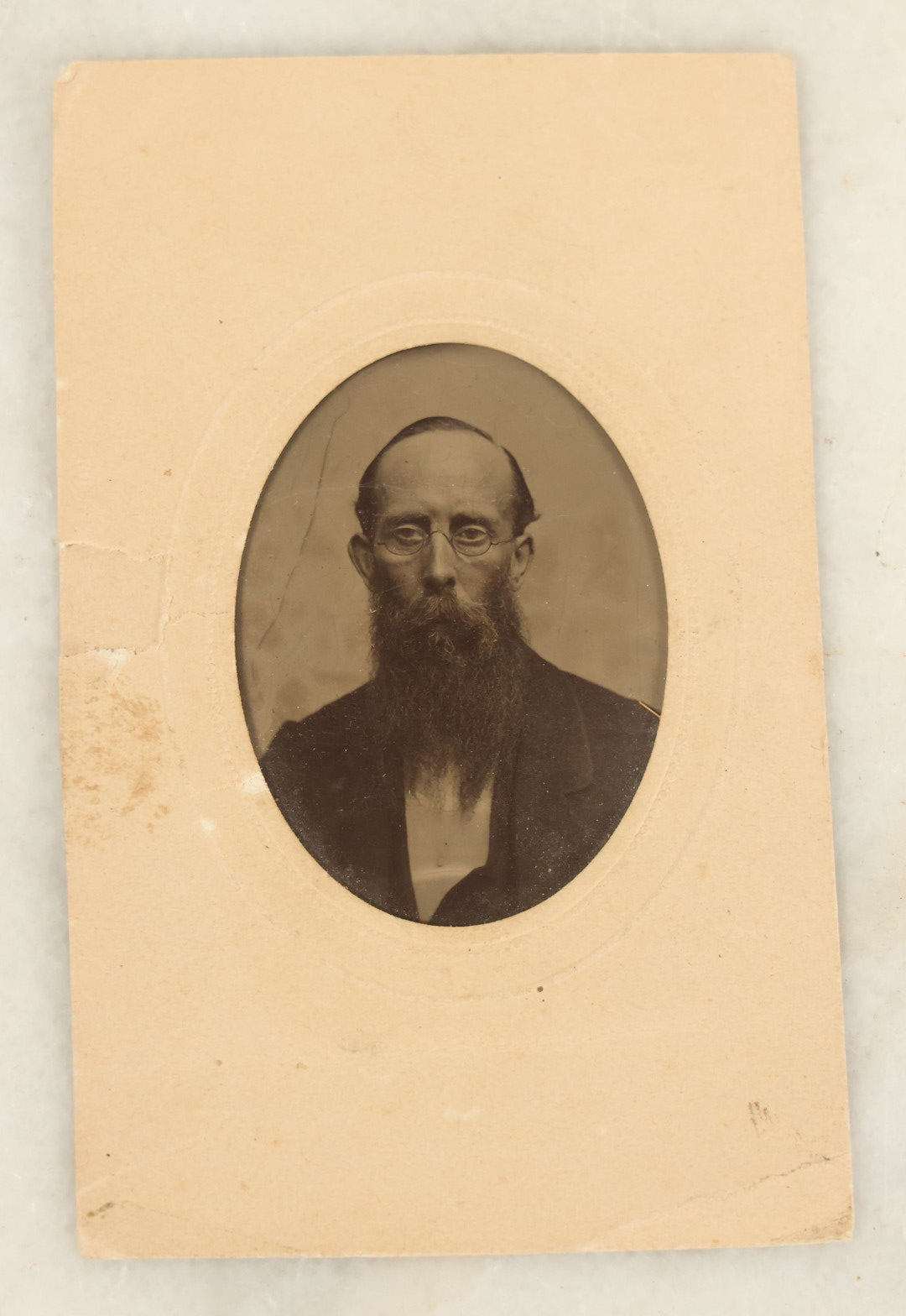 Lot 094 - Grouping Of Ten Tintypes Of Men, Women, And Children, Including Old Man With Beard, Man With Watch Chain, Boy Standing At Table, Others, Four With Paper Frames