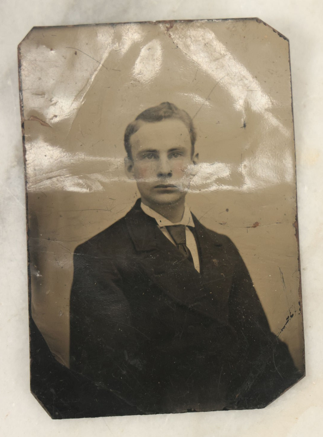 Lot 094 - Grouping Of Ten Tintypes Of Men, Women, And Children, Including Old Man With Beard, Man With Watch Chain, Boy Standing At Table, Others, Four With Paper Frames
