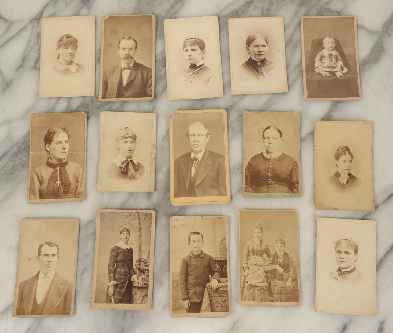 Lot 099 - Grouping Of Antique 15 Carte De Visite C.D.V. Photographs Of Men, Women, And Children, Including Woman With Cross, Man With Large Mustached, Seated Child, And Others