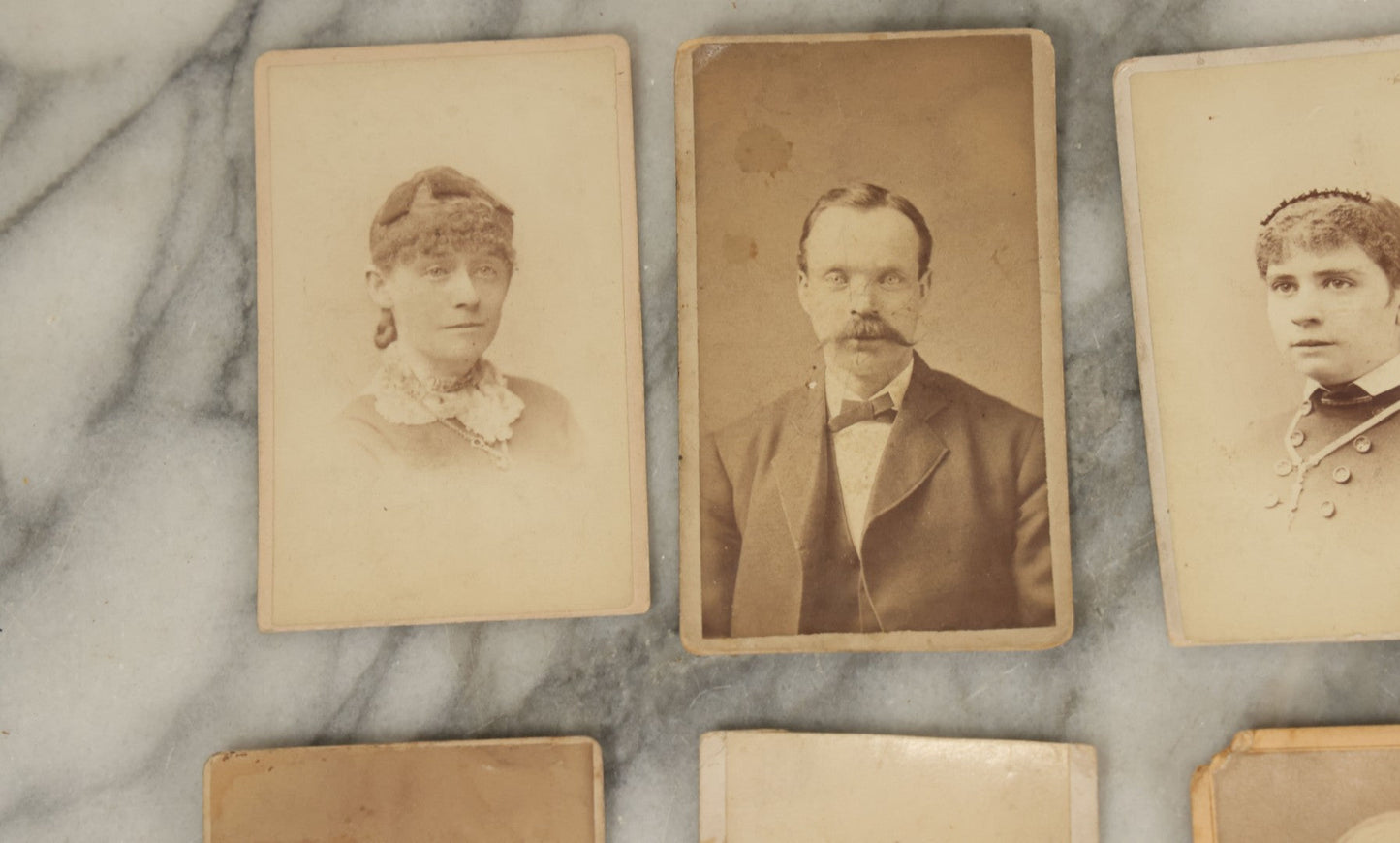 Lot 099 - Grouping Of Antique 15 Carte De Visite C.D.V. Photographs Of Men, Women, And Children, Including Woman With Cross, Man With Large Mustached, Seated Child, And Others