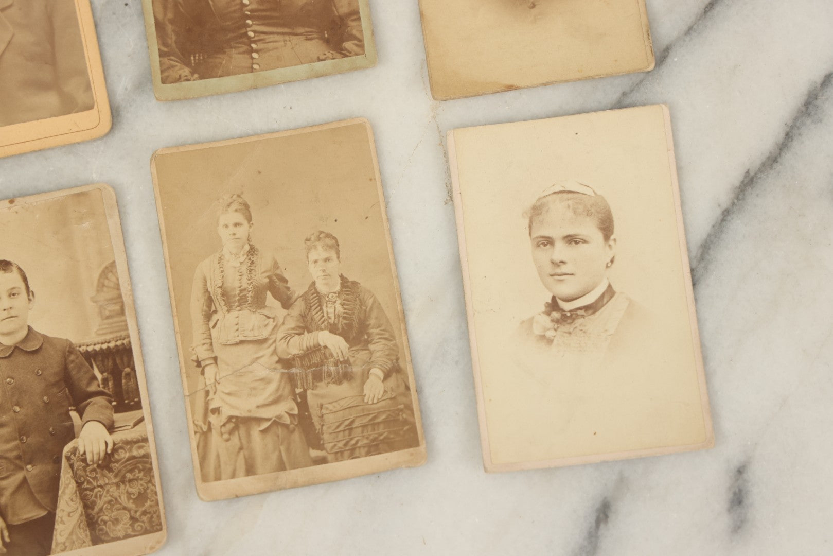 Lot 099 - Grouping Of Antique 15 Carte De Visite C.D.V. Photographs Of Men, Women, And Children, Including Woman With Cross, Man With Large Mustached, Seated Child, And Others