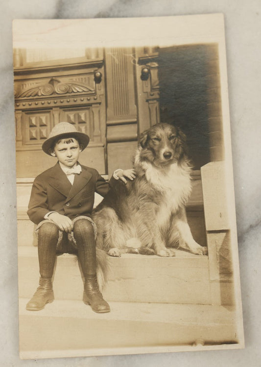 Lot 100 - Single Antique Real Photo Postcard, R.P.P.C., Boy In Hat Sitting On Stoop With Dog