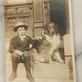 Lot 100 - Single Antique Real Photo Postcard, R.P.P.C., Boy In Hat Sitting On Stoop With Dog