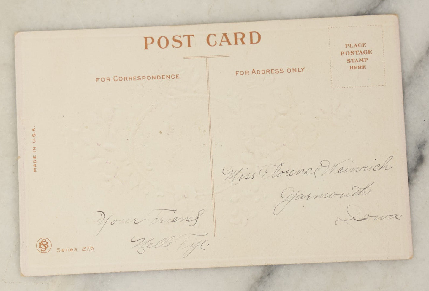 Lot 104 - Single Antique Postcard With Clipped Photo Of Young Woman With Large Bow, Purple Flower Design, Signed On Verso