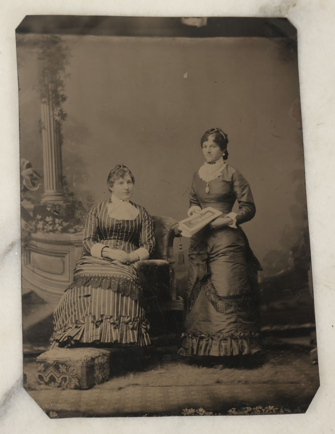 Lot 111 - Approximately Half Plate Antique Tintype Photograph Of Two Women, One Holding A Book With Illustrations