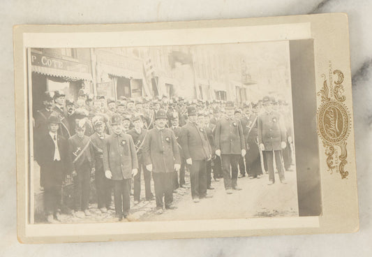 Lot 113 - Antique Photo Mounted On Cabinet Card (Not Original To Card) Of A Fraternal Memorial Parade, Possible Funeral, With Men In Hats, "In Memoriam" Sashes, Mark From Duclor Photographer, Manchester, New Hampshire