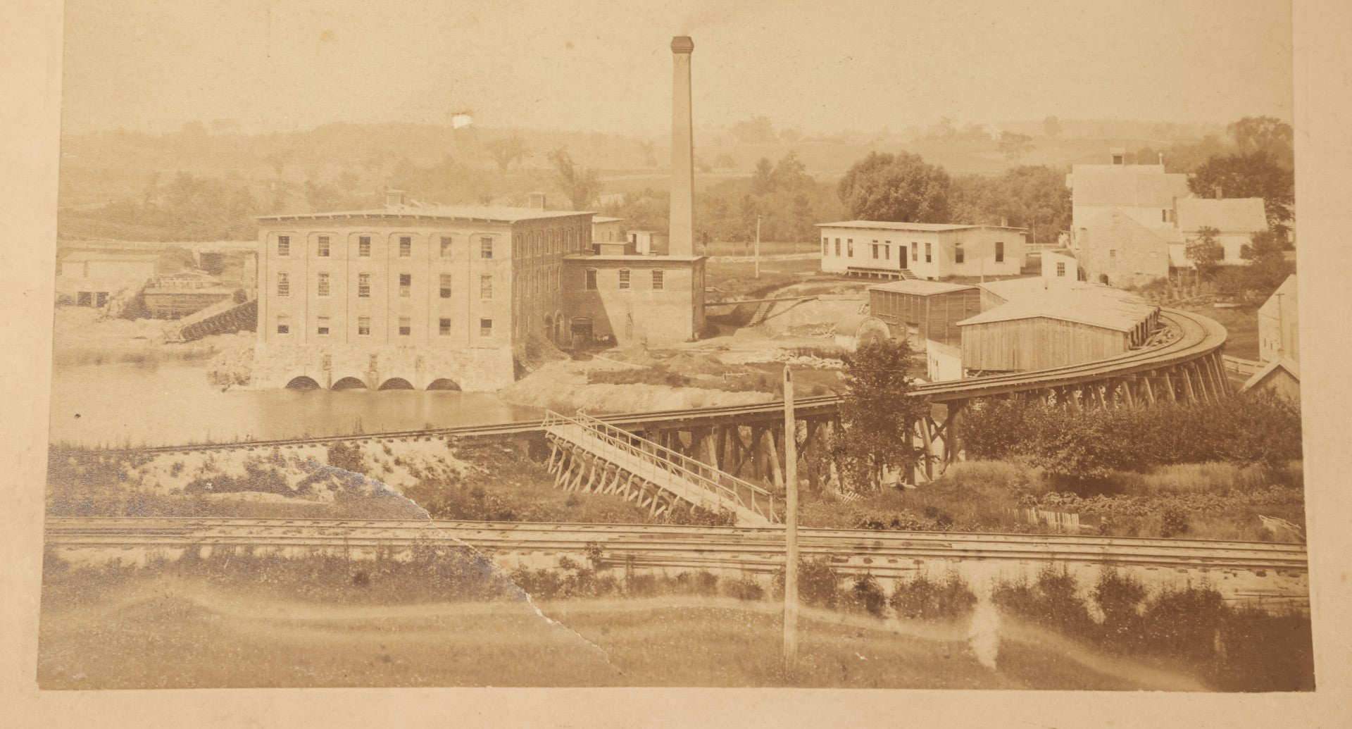 Lot 115 - Antique Boarded Photograph Of A Factory With Train Tracks, Chimney, Back Marked "Everett Coffin" In Pencil, Note States Chimney Removed 1945