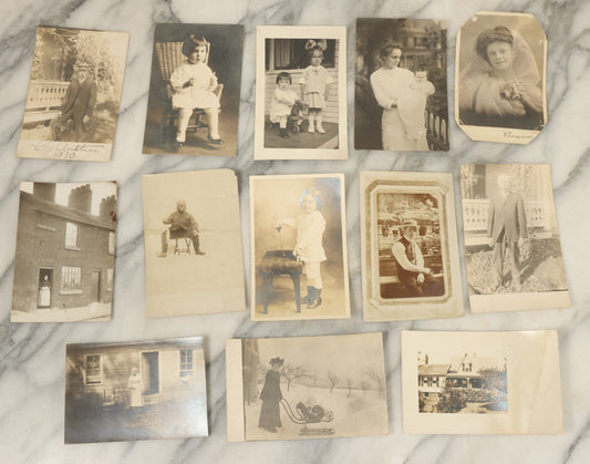 Lot 117 - Grouping Of Thirteen Antique Real Photo Postcards R.P.P.C. Including Man Fishing, Woman With Sled Pram, And Others