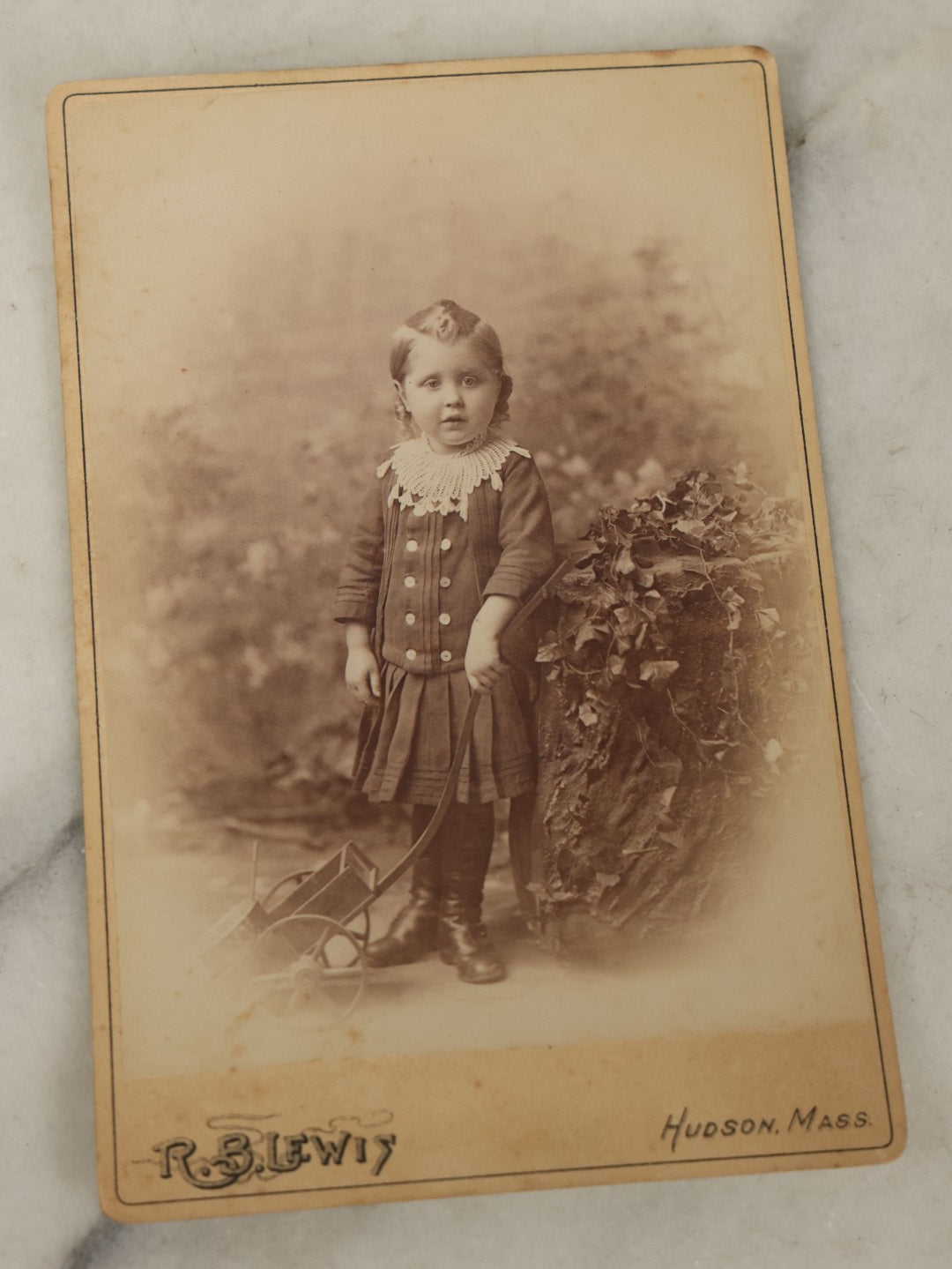 Lot 118 - Grouping Of Four Antique Photographs Including A Large Interior Photo Of People All Dressed In Black, A Cabinet Card Of A Park, Possibly Boston Common, A Child With A Cart, And A Horse Drawn Sleigh