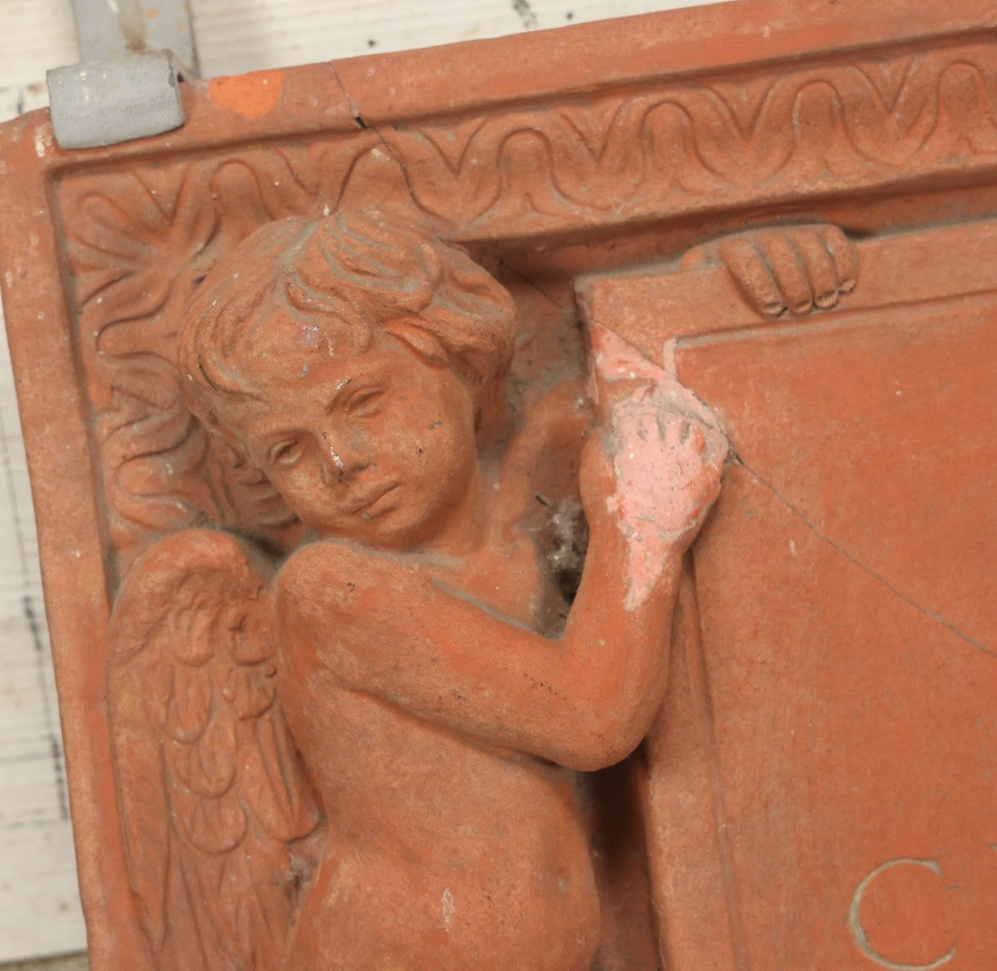 Lot 004 - Vintage Cast Terracotta Relief Family Grave Marker Plaque, Cerruti Family, With Cherubs On Either Side, Including Metal Brackets, Note Repairs, Heavy Damage, 19" x 19-7/8"