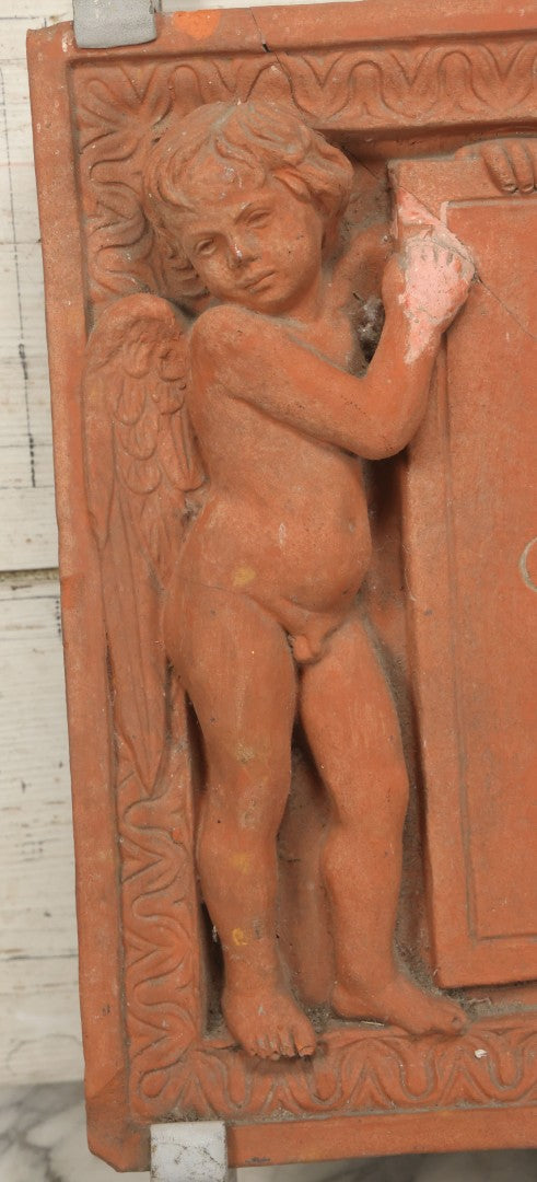 Lot 004 - Vintage Cast Terracotta Relief Family Grave Marker Plaque, Cerruti Family, With Cherubs On Either Side, Including Metal Brackets, Note Repairs, Heavy Damage, 19" x 19-7/8"