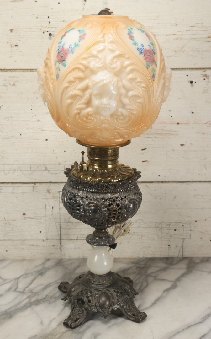 Lot 006 - Antique Victorian Electrified Gone With The Wind Oil Lamp With Ornate Metal Base & Embossed Cherub Glass Globe, Note Cracks, Repairs To Globe, Working Condition, Approximately 26" Overall Height