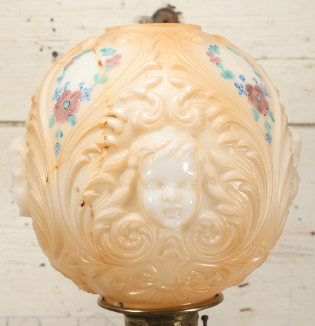 Lot 006 - Antique Victorian Electrified Gone With The Wind Oil Lamp With Ornate Metal Base & Embossed Cherub Glass Globe, Note Cracks, Repairs To Globe, Working Condition, Approximately 26" Overall Height