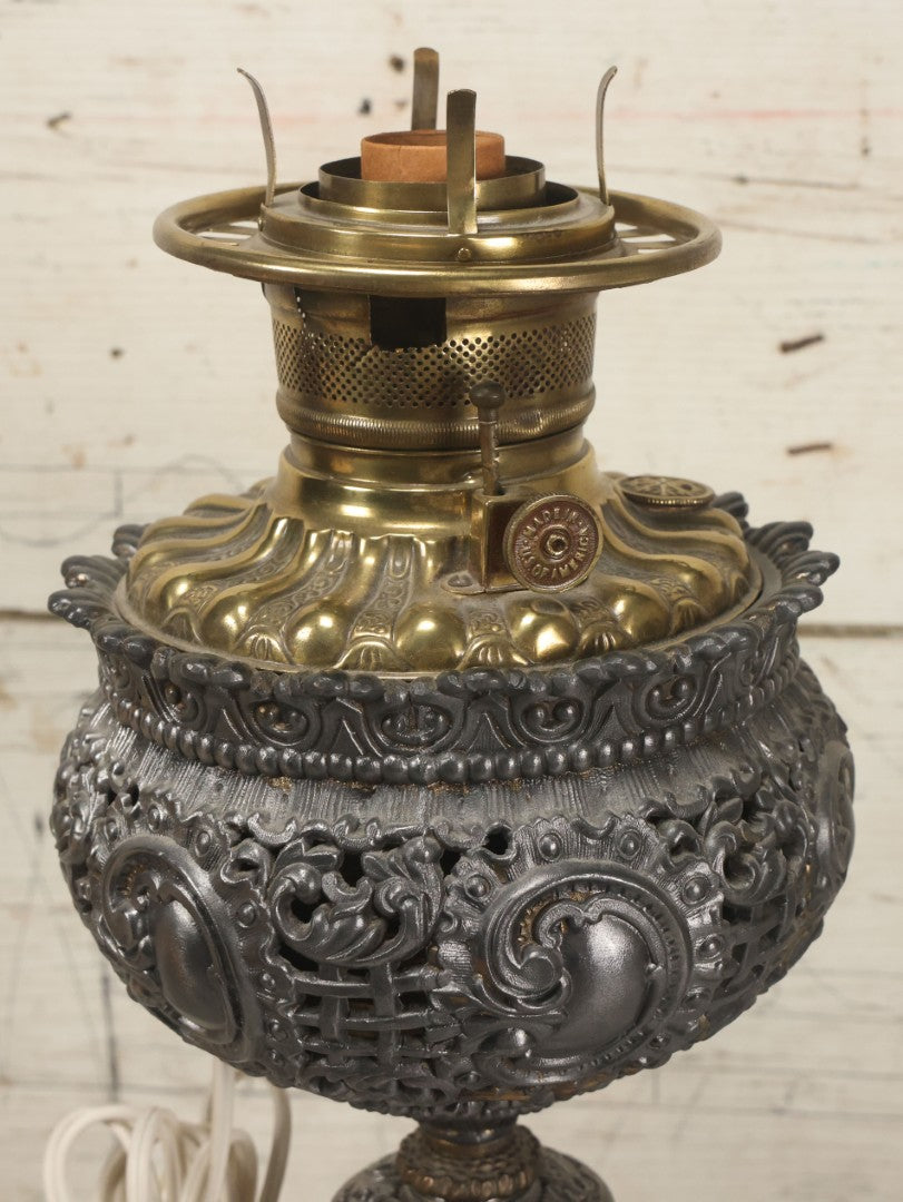 Lot 006 - Antique Victorian Electrified Gone With The Wind Oil Lamp With Ornate Metal Base & Embossed Cherub Glass Globe, Note Cracks, Repairs To Globe, Working Condition, Approximately 26" Overall Height