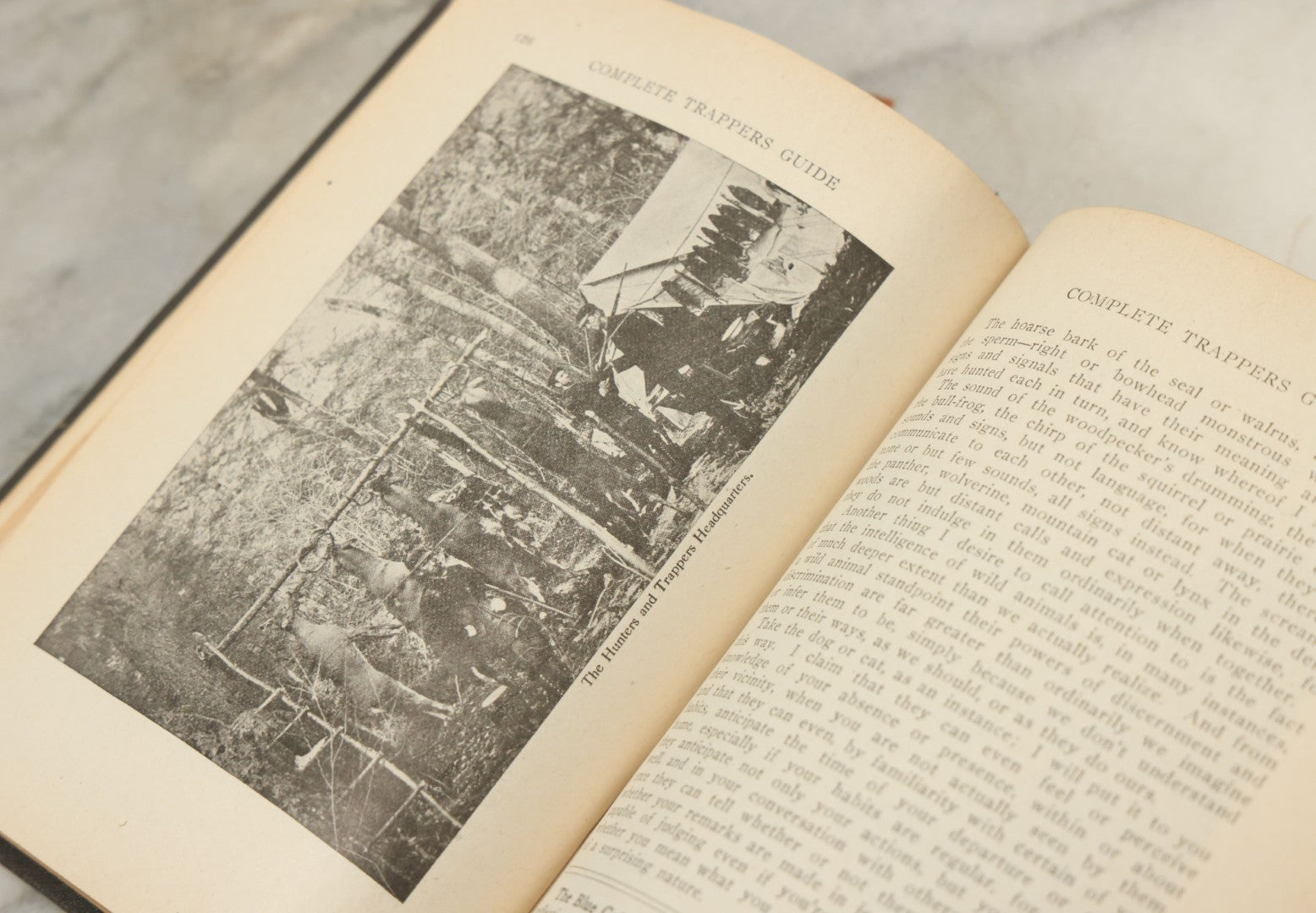 Lot 122 - "Buzzacott's Masterpiece Or The Complete Hunters', Trappers', And Campers' Library Of Valuable Information" Antique Book With Photos By "Buzzacott," Mcmains & Meyer Publishers, 1913