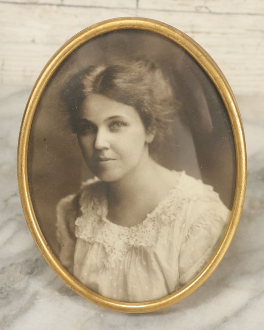 Lot 127 - Antique Framed Portrait Photo Of A Pretty Young Smiling Woman In A Brass Frame By John Wanamaker, 4-1/4" x 5-5/8"