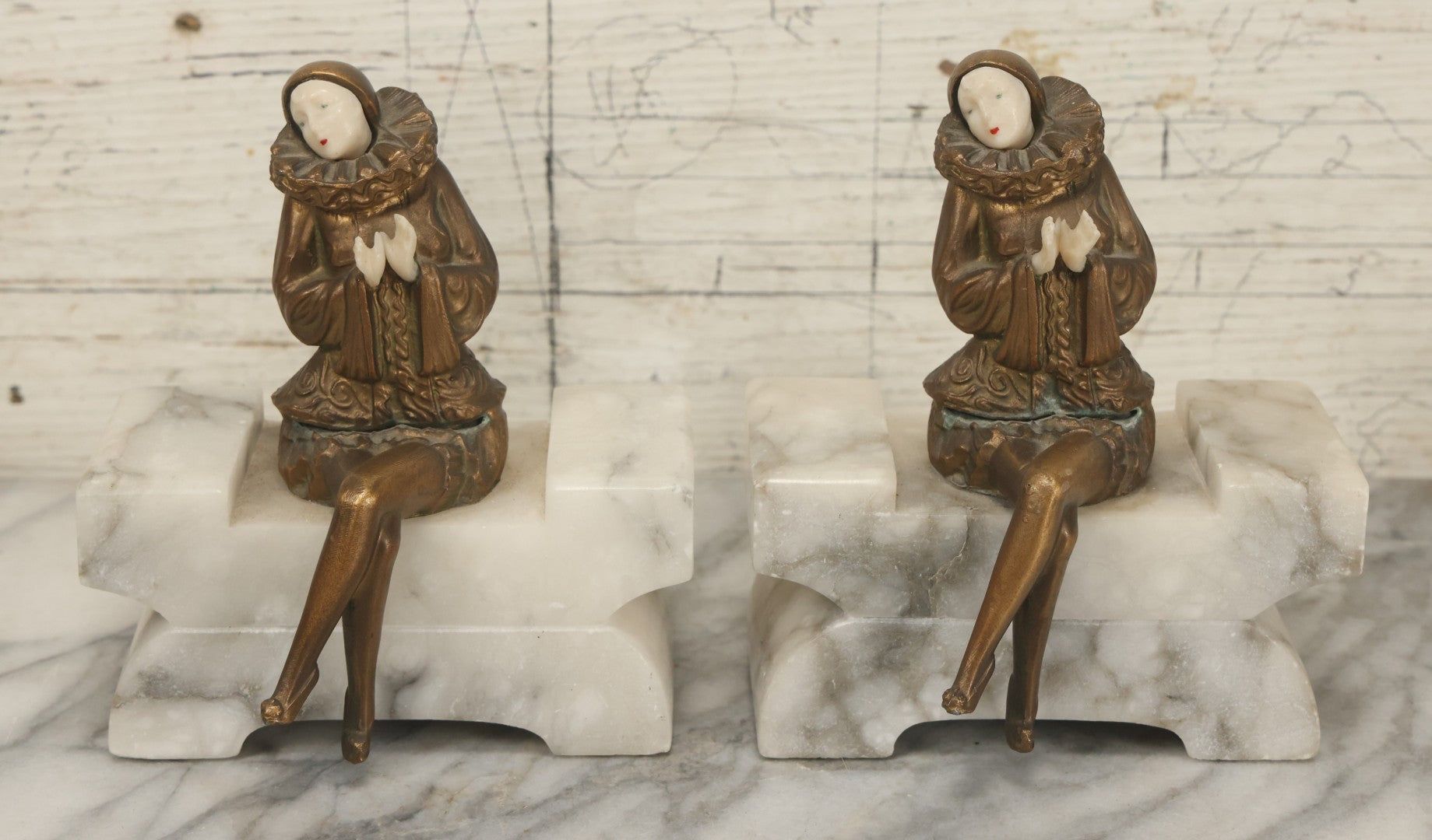 Lot 009 - Pair Of Art Deco Figural Pierrot Bookends, Cast Metal With Marble Bases, Sitting Clown Design