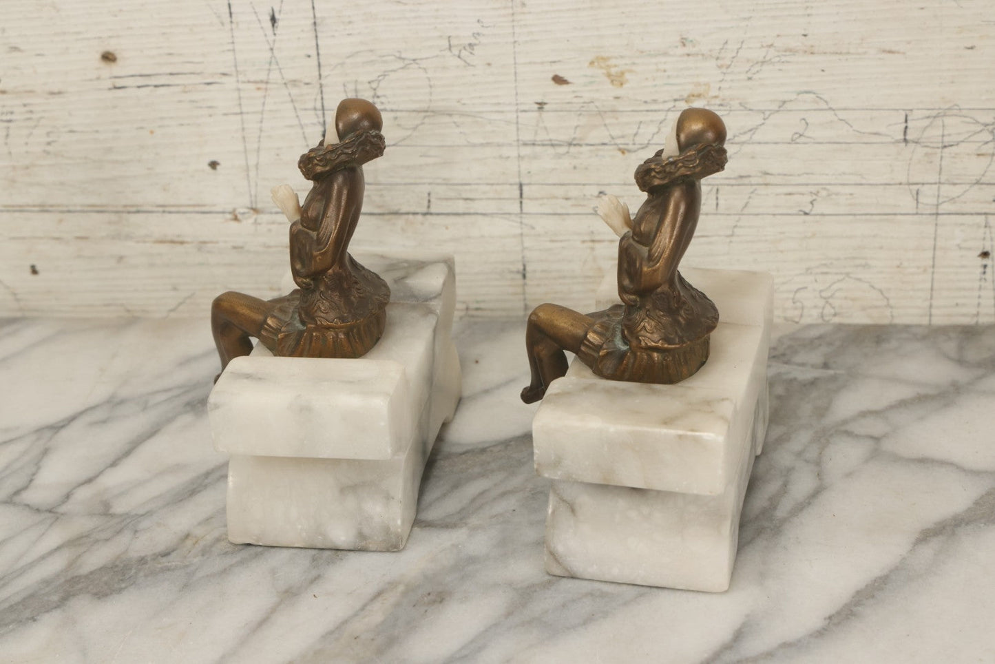 Lot 009 - Pair Of Art Deco Figural Pierrot Bookends, Cast Metal With Marble Bases, Sitting Clown Design