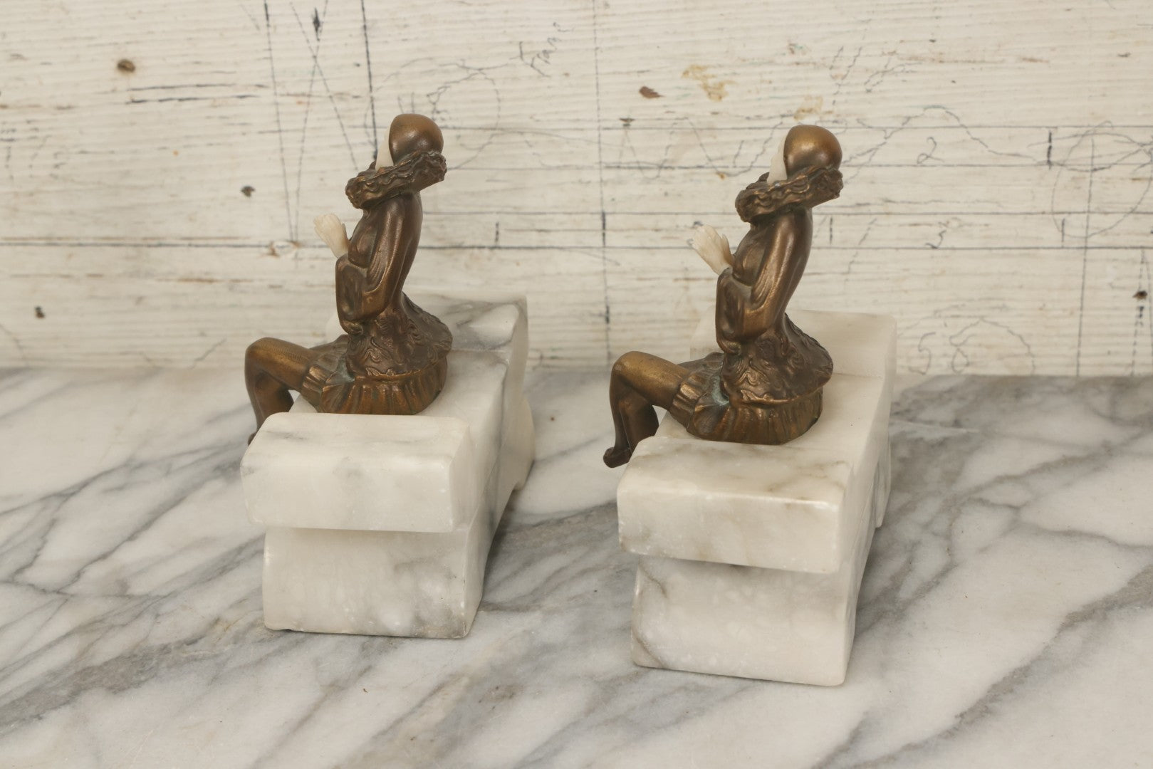 Lot 009 - Pair Of Art Deco Figural Pierrot Bookends, Cast Metal With Marble Bases, Sitting Clown Design