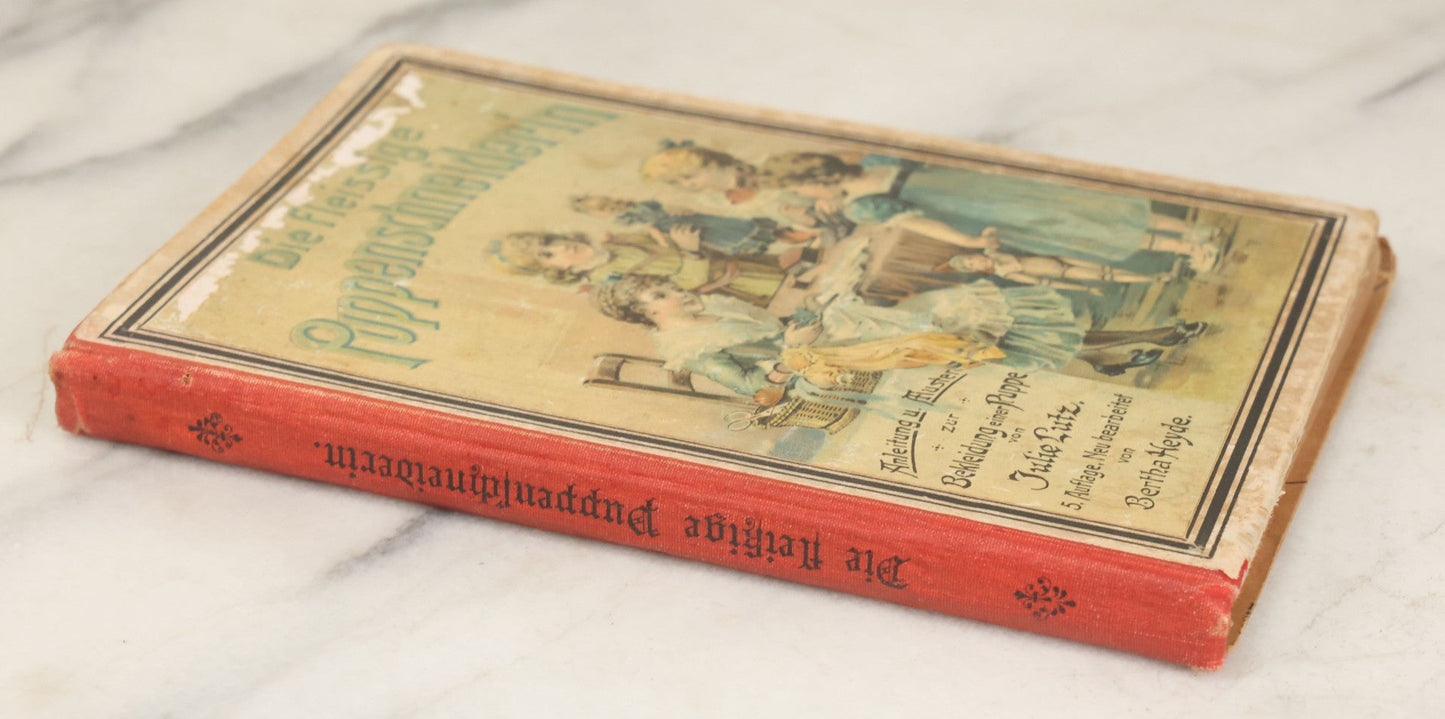 Lot 166 - "The Hard Working Doll Tailor: Instructions And Whispers How To Dress A Doll" Antique German Book By Julie Lutz, Fifth Edition, With Full Color Plates