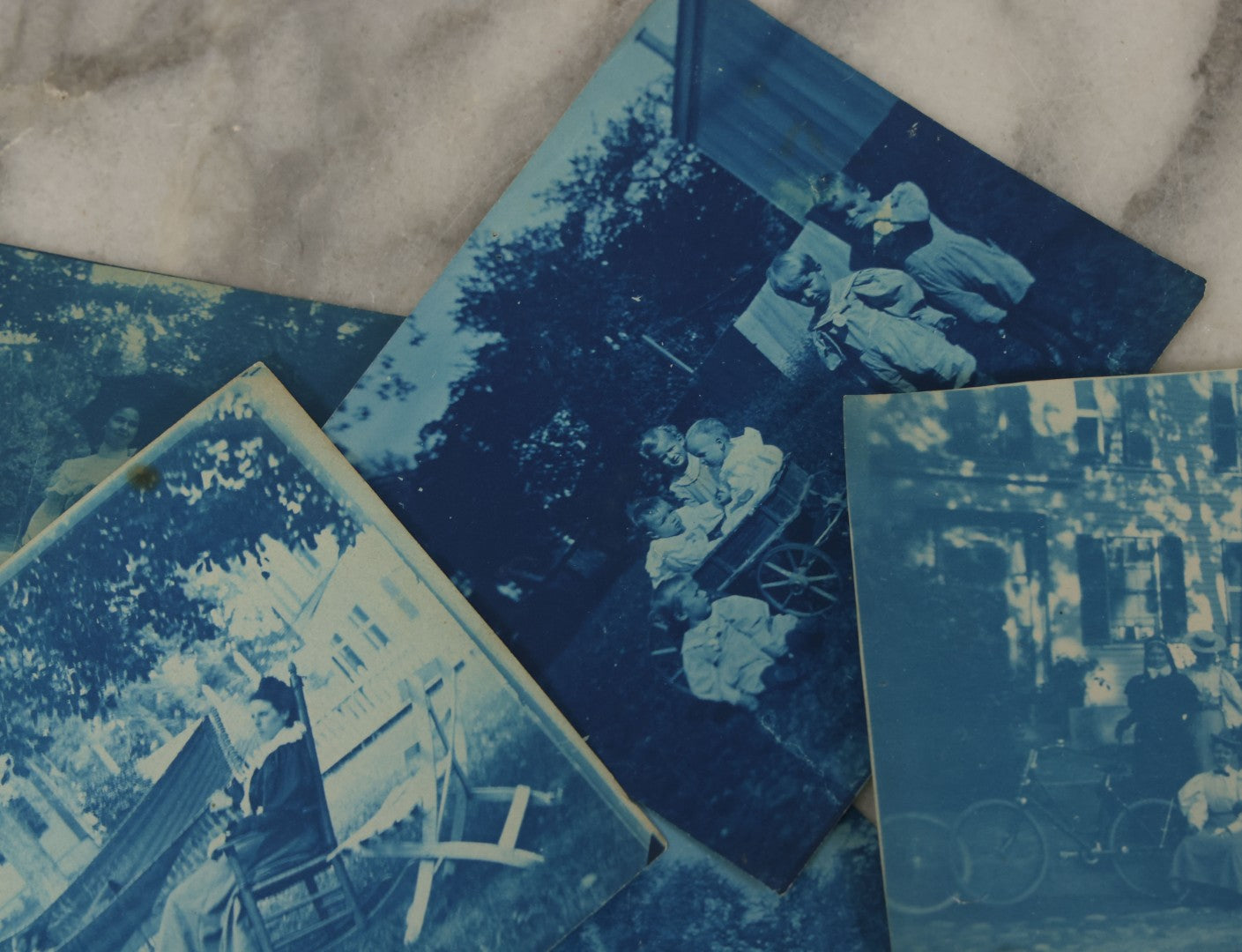 Lot 170 - Grouping Of 9 Snapshot Photographs Including 8 Cyanotypes Of Victorian Women And Children, Women With Bicycles, Skiing, Etc.