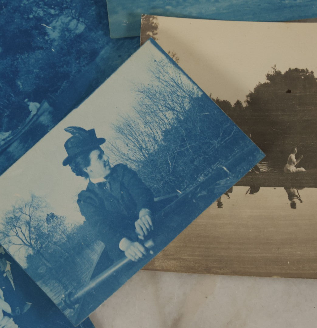 Lot 170 - Grouping Of 9 Snapshot Photographs Including 8 Cyanotypes Of Victorian Women And Children, Women With Bicycles, Skiing, Etc.