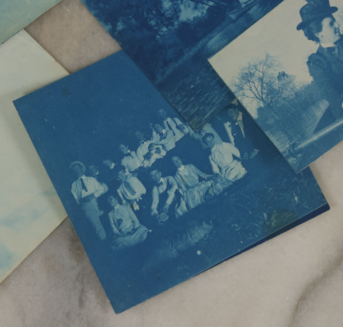 Lot 170 - Grouping Of 9 Snapshot Photographs Including 8 Cyanotypes Of Victorian Women And Children, Women With Bicycles, Skiing, Etc.