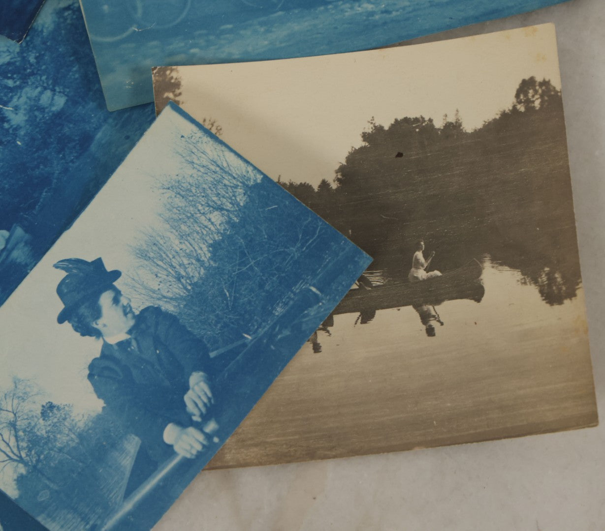 Lot 170 - Grouping Of 9 Snapshot Photographs Including 8 Cyanotypes Of Victorian Women And Children, Women With Bicycles, Skiing, Etc.