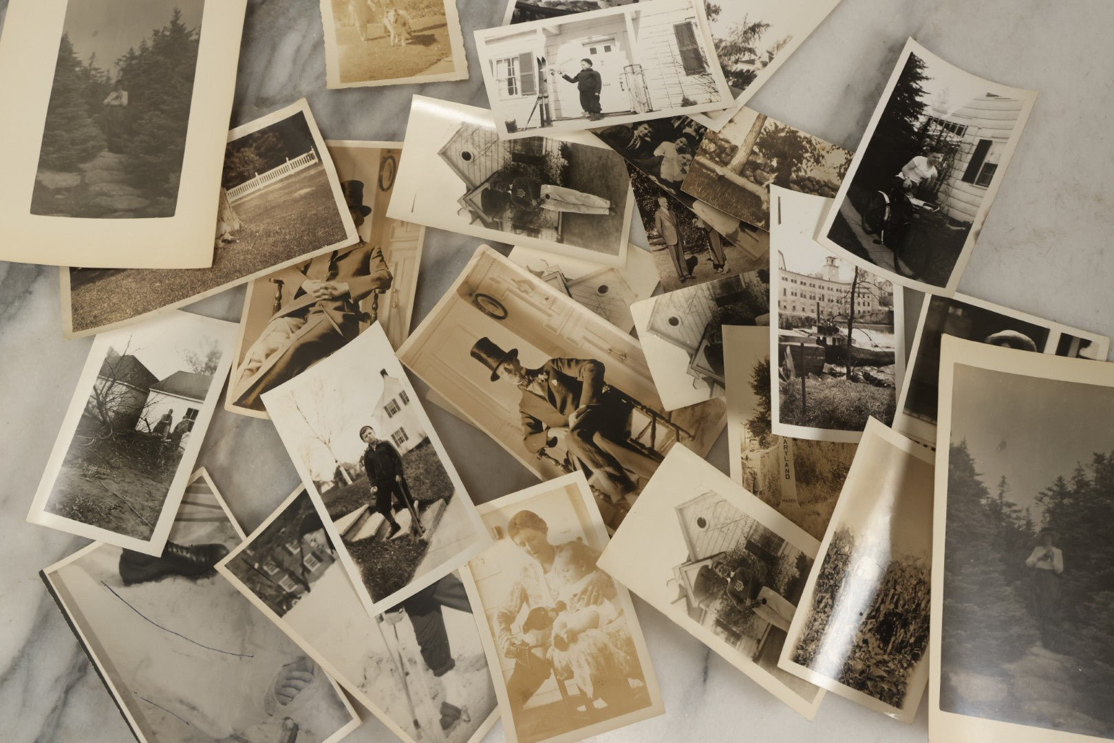 Lot 173 - Grouping Of 20+ Vintage And Antique Snapshot Photographs Including Boy With Baseball Bat, Boy With Bugle, Boy With Plane, Boy Riding Bike, Old Man In Stovepipe Hat, Etc.
