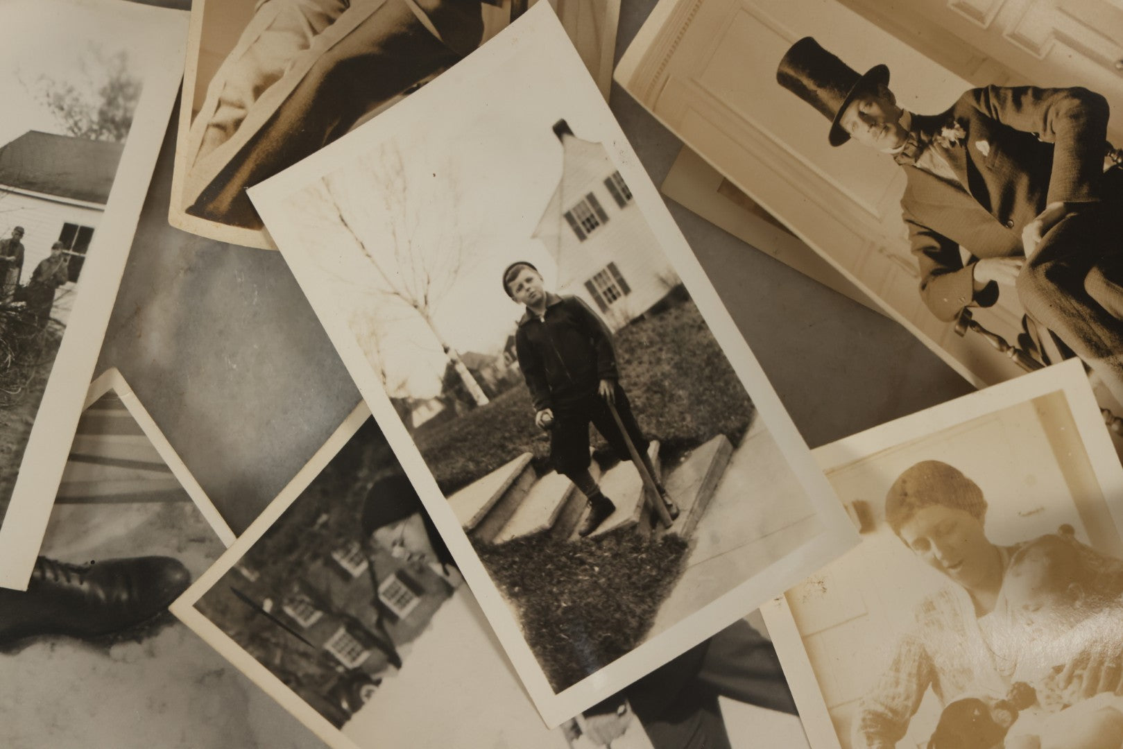Lot 173 - Grouping Of 20+ Vintage And Antique Snapshot Photographs Including Boy With Baseball Bat, Boy With Bugle, Boy With Plane, Boy Riding Bike, Old Man In Stovepipe Hat, Etc.