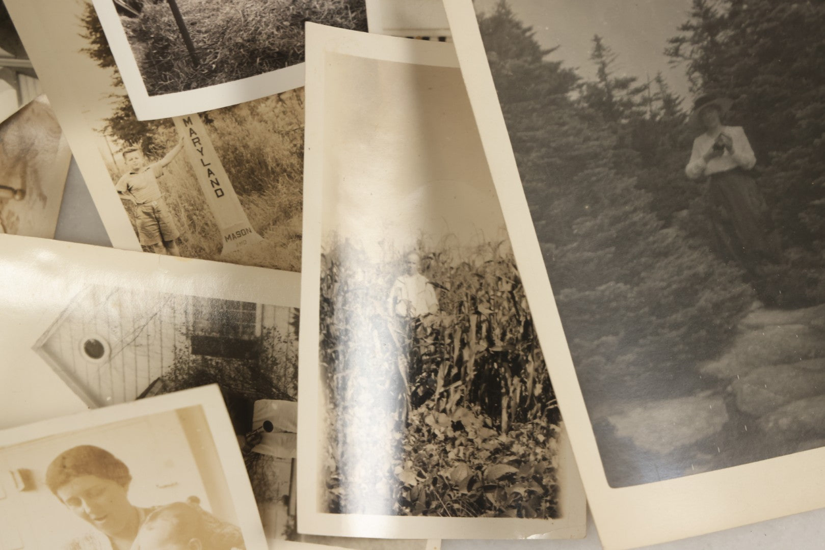 Lot 173 - Grouping Of 20+ Vintage And Antique Snapshot Photographs Including Boy With Baseball Bat, Boy With Bugle, Boy With Plane, Boy Riding Bike, Old Man In Stovepipe Hat, Etc.