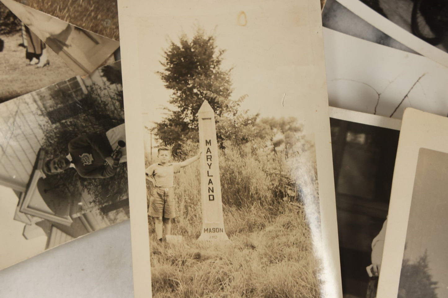 Lot 173 - Grouping Of 20+ Vintage And Antique Snapshot Photographs Including Boy With Baseball Bat, Boy With Bugle, Boy With Plane, Boy Riding Bike, Old Man In Stovepipe Hat, Etc.