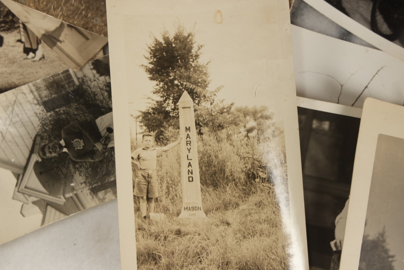 Lot 173 - Grouping Of 20+ Vintage And Antique Snapshot Photographs Including Boy With Baseball Bat, Boy With Bugle, Boy With Plane, Boy Riding Bike, Old Man In Stovepipe Hat, Etc.