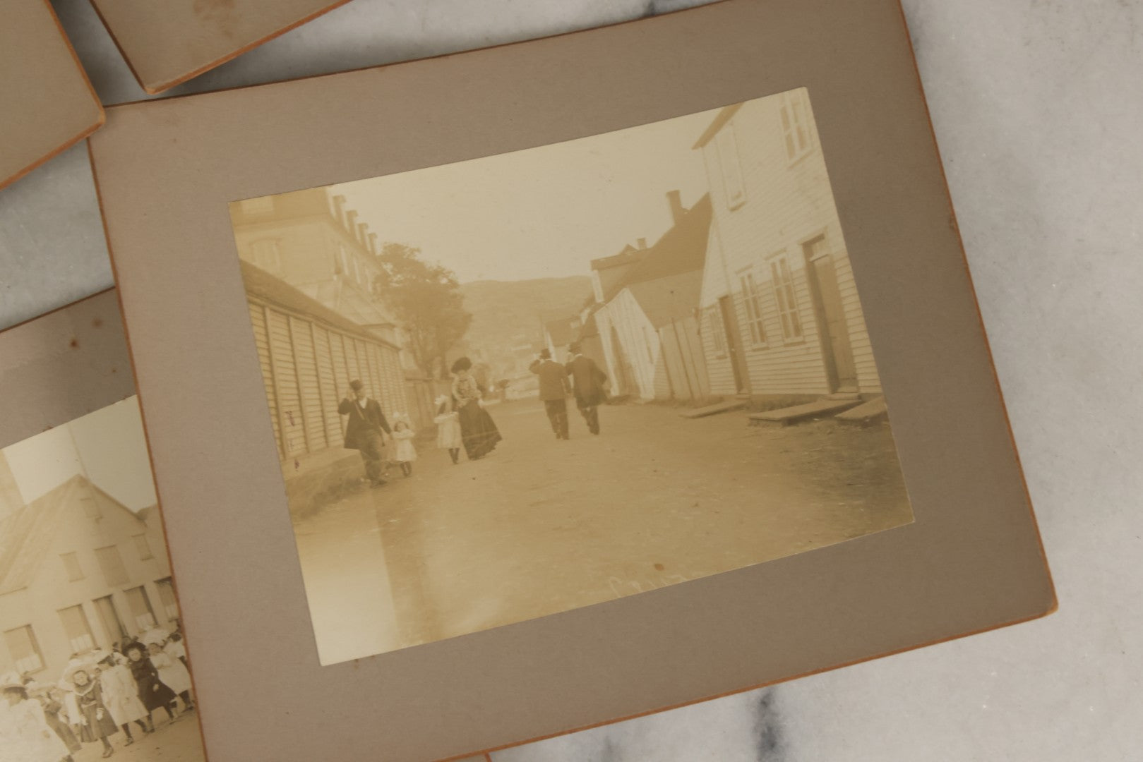 Lot 175 - Grouping Of Six Antique Boarded Photographs Of The Streets, People, Buildings, And Festivals Of Saint Pierre And Miquelon (French Territory Near Newfoundland, Canada)