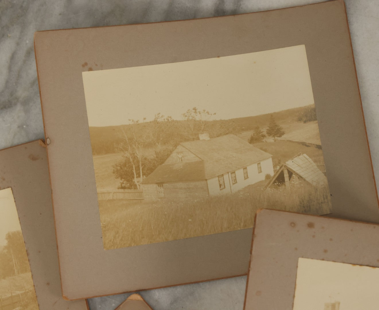 Lot 177 - Grouping Of Four Antique Boarded Photographs Of Houses, Cabins, Etc., In And Around Saint Pierre And Miquelon (French Territory Near Newfoundland, Canada)