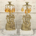 Lot 014 - Antique Gilded Brass Girandole Candelabra Pair, Romantic Rococo Scene With Dog, Marble Base, Amber Crystal Prisms, Note Many Missing, Damaged Crystals, Bases Chipped