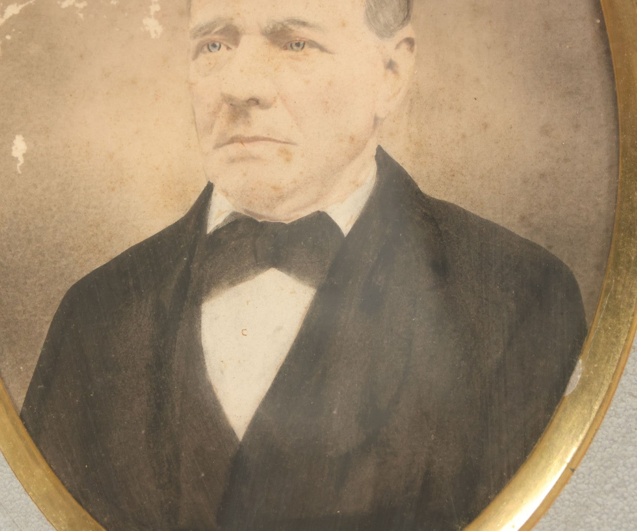 Lot 022 - Antique Over Painted Portrait Photo Of A Man With Gray Hair, Bowtie, In Deep Frame, Note Losses To Photo Surface, 11-7/8" x 13-7/8"