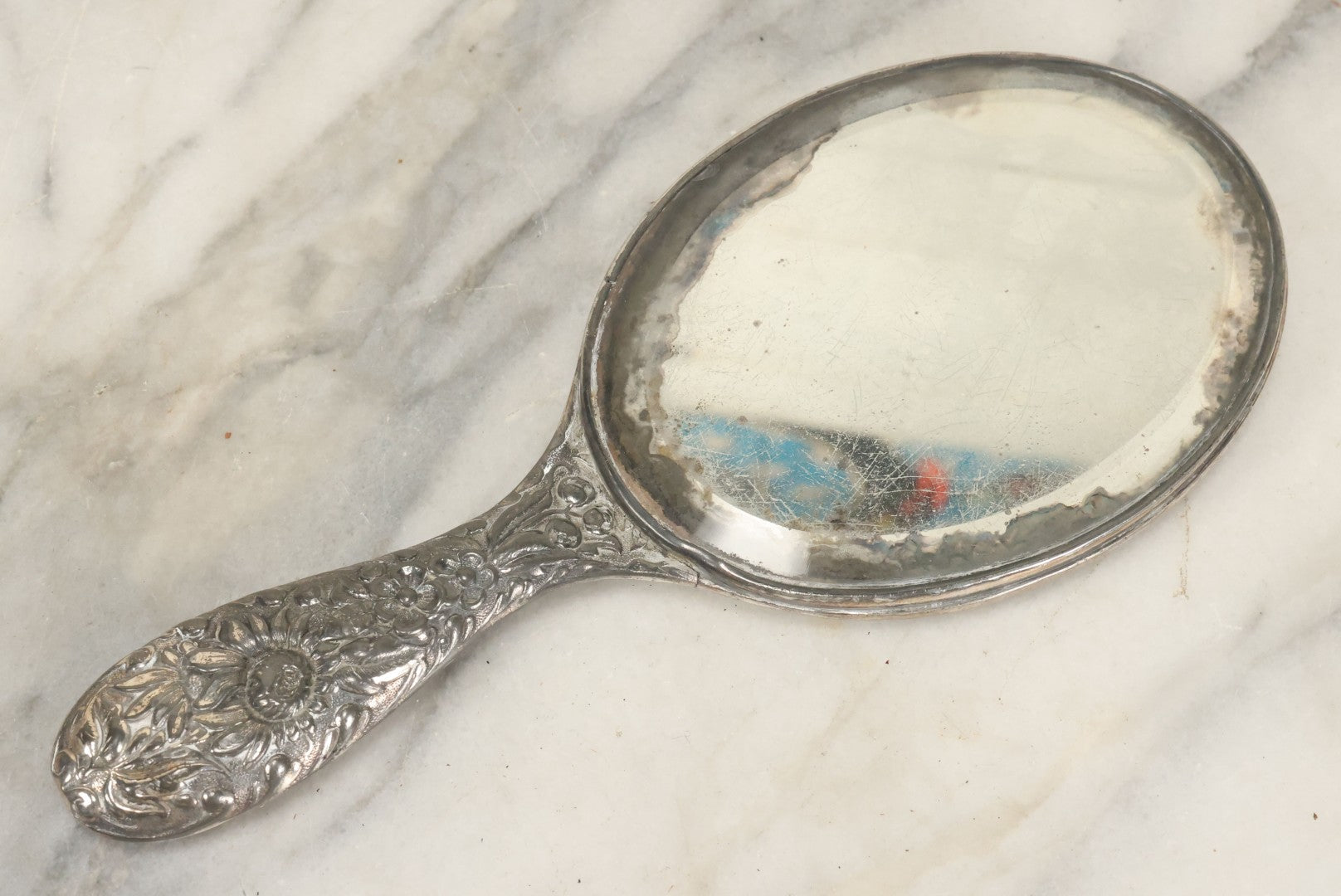 Lot 025 - Antique Silverplate Hand Mirror, Floral Repoussé Design, Beveled Glass, Note Wear To Mirror