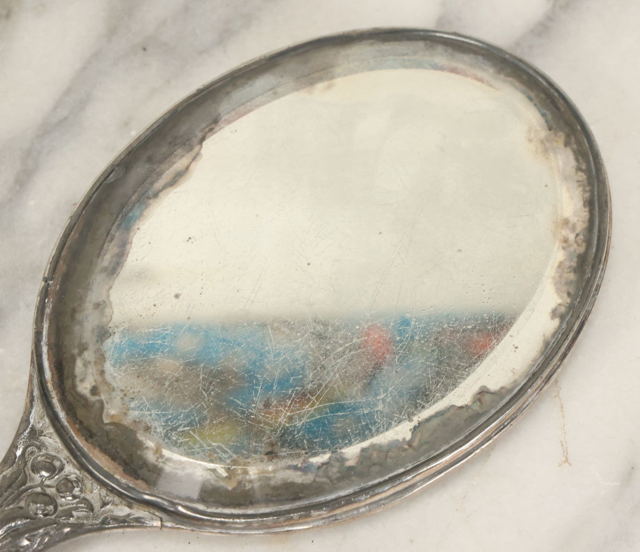 Lot 025 - Antique Silverplate Hand Mirror, Floral Repoussé Design, Beveled Glass, Note Wear To Mirror