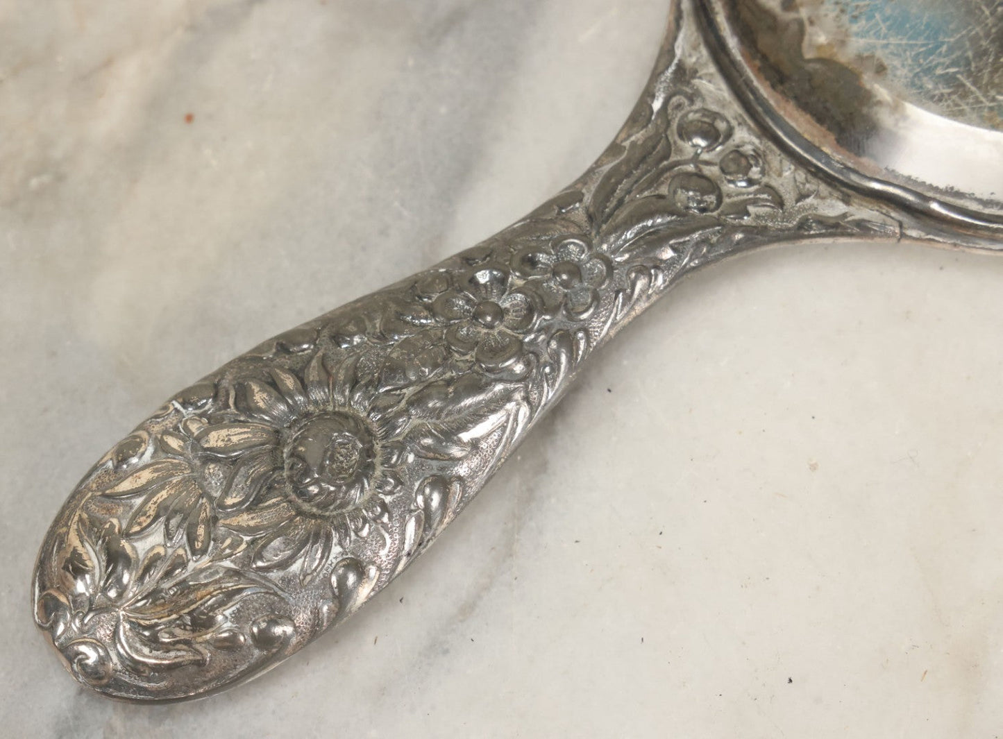 Lot 025 - Antique Silverplate Hand Mirror, Floral Repoussé Design, Beveled Glass, Note Wear To Mirror