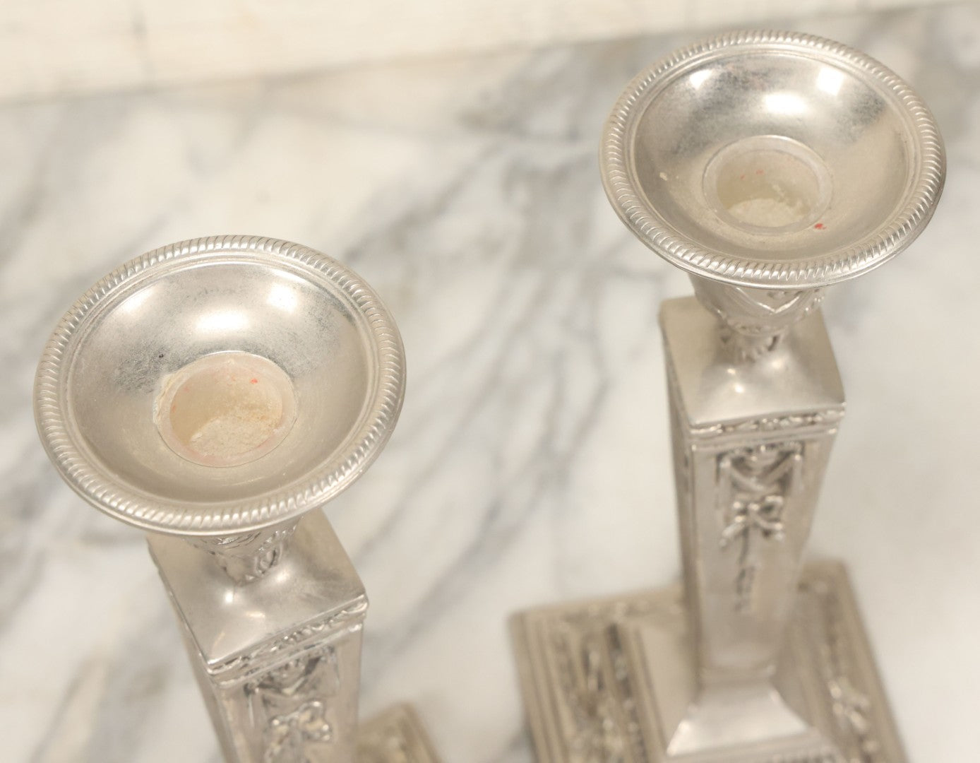 Lot 026 - Pair Of Vintage Silverplate Candlesticks, Neoclassical Design, Goat Head Motif, Ribbon And Garland Detailing