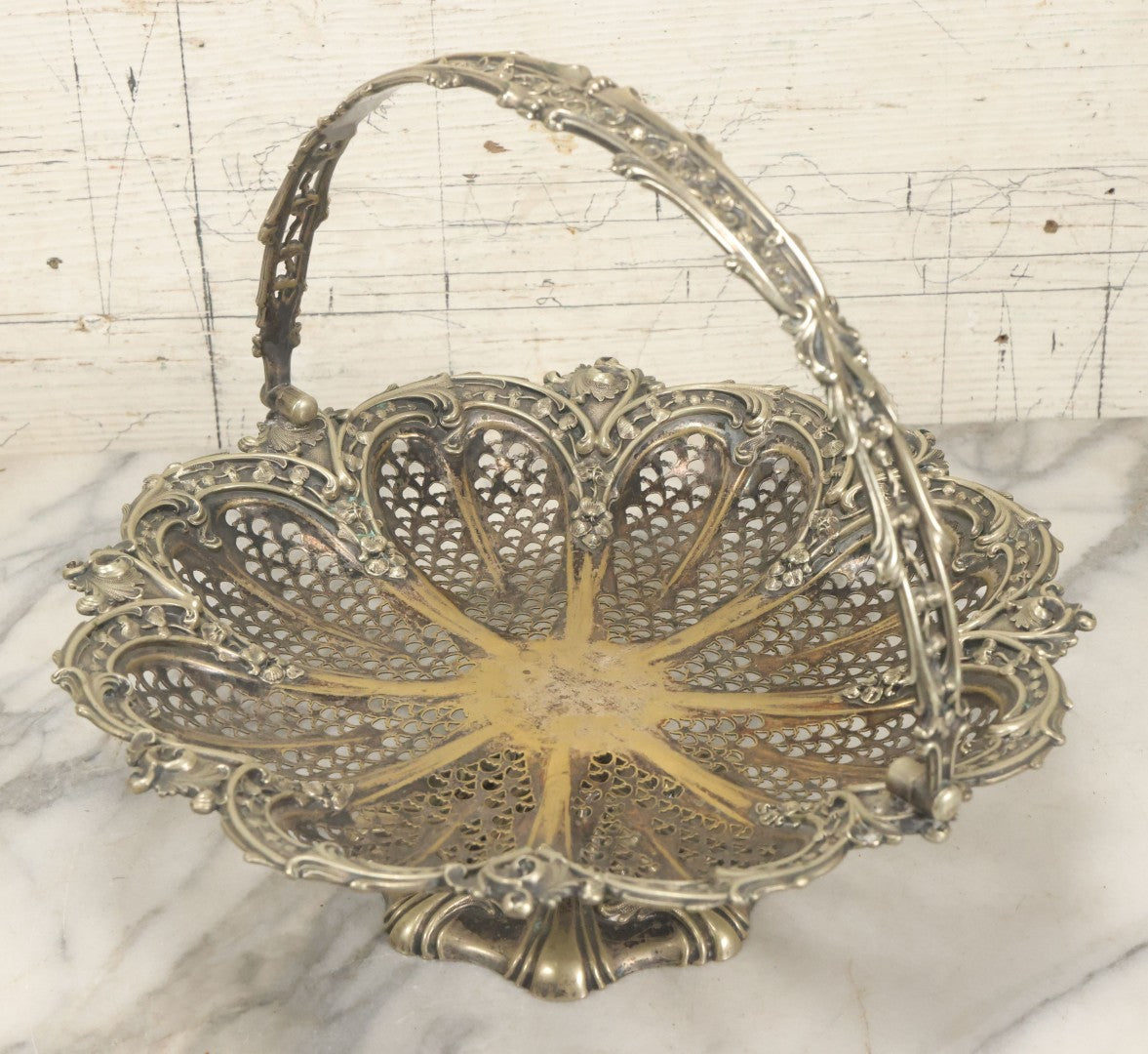 Lot 028 - Antique Silverplate Pierced Basket, Ornate Rococo Style, Footed Base With Hinged Handle, Tarnished Patina
