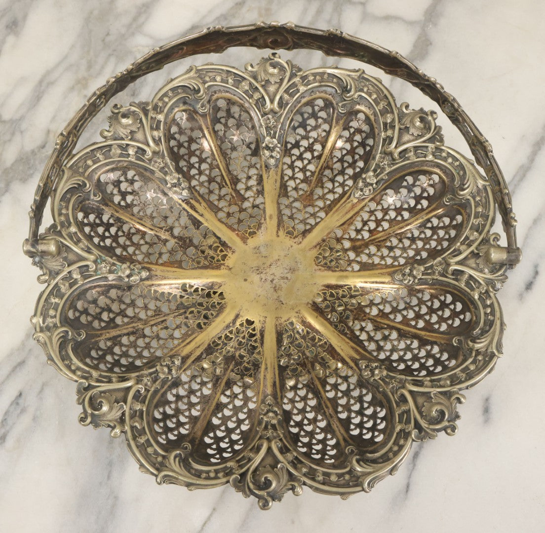 Lot 028 - Antique Silverplate Pierced Basket, Ornate Rococo Style, Footed Base With Hinged Handle, Tarnished Patina