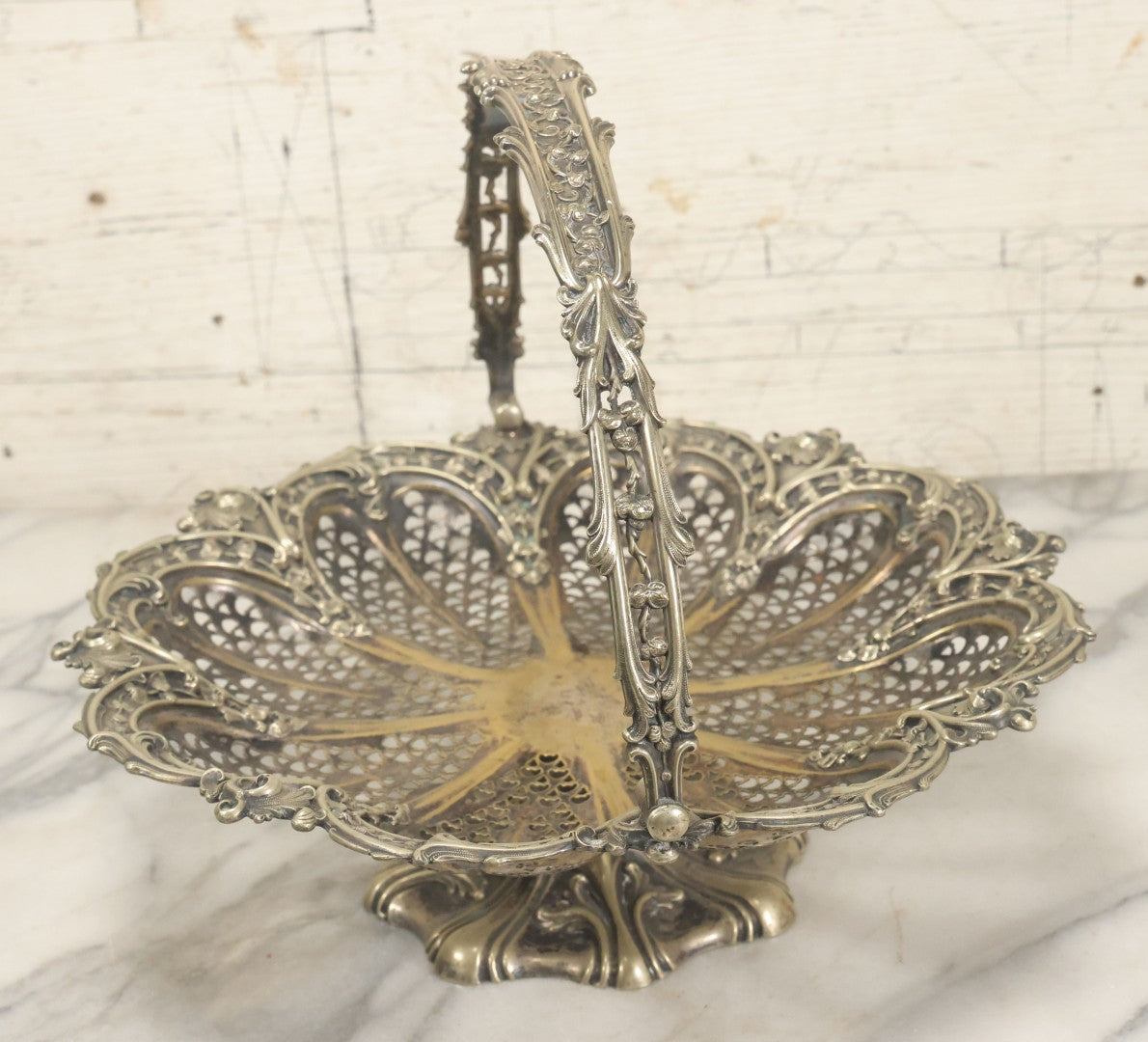 Lot 028 - Antique Silverplate Pierced Basket, Ornate Rococo Style, Footed Base With Hinged Handle, Tarnished Patina