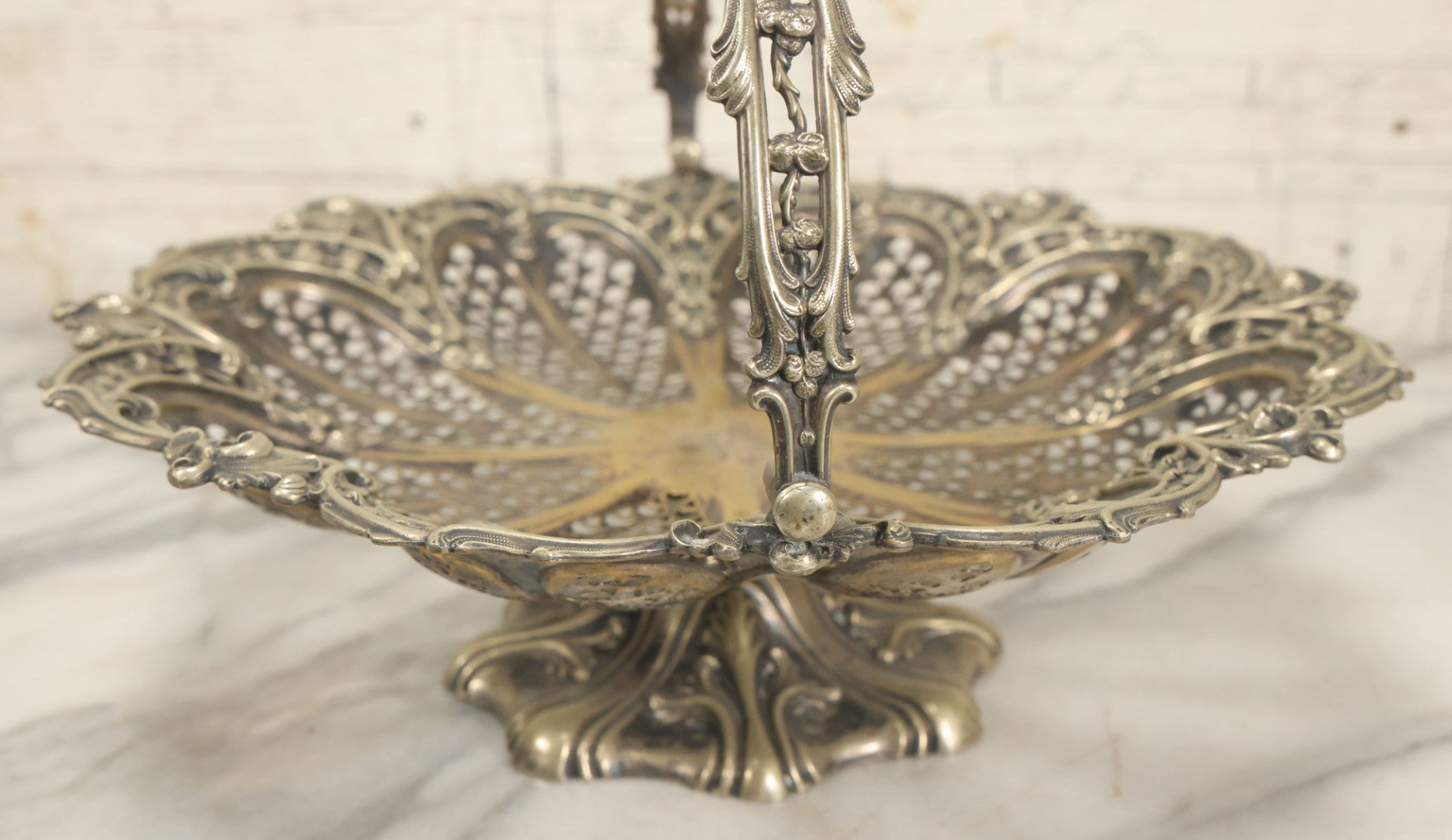 Lot 028 - Antique Silverplate Pierced Basket, Ornate Rococo Style, Footed Base With Hinged Handle, Tarnished Patina