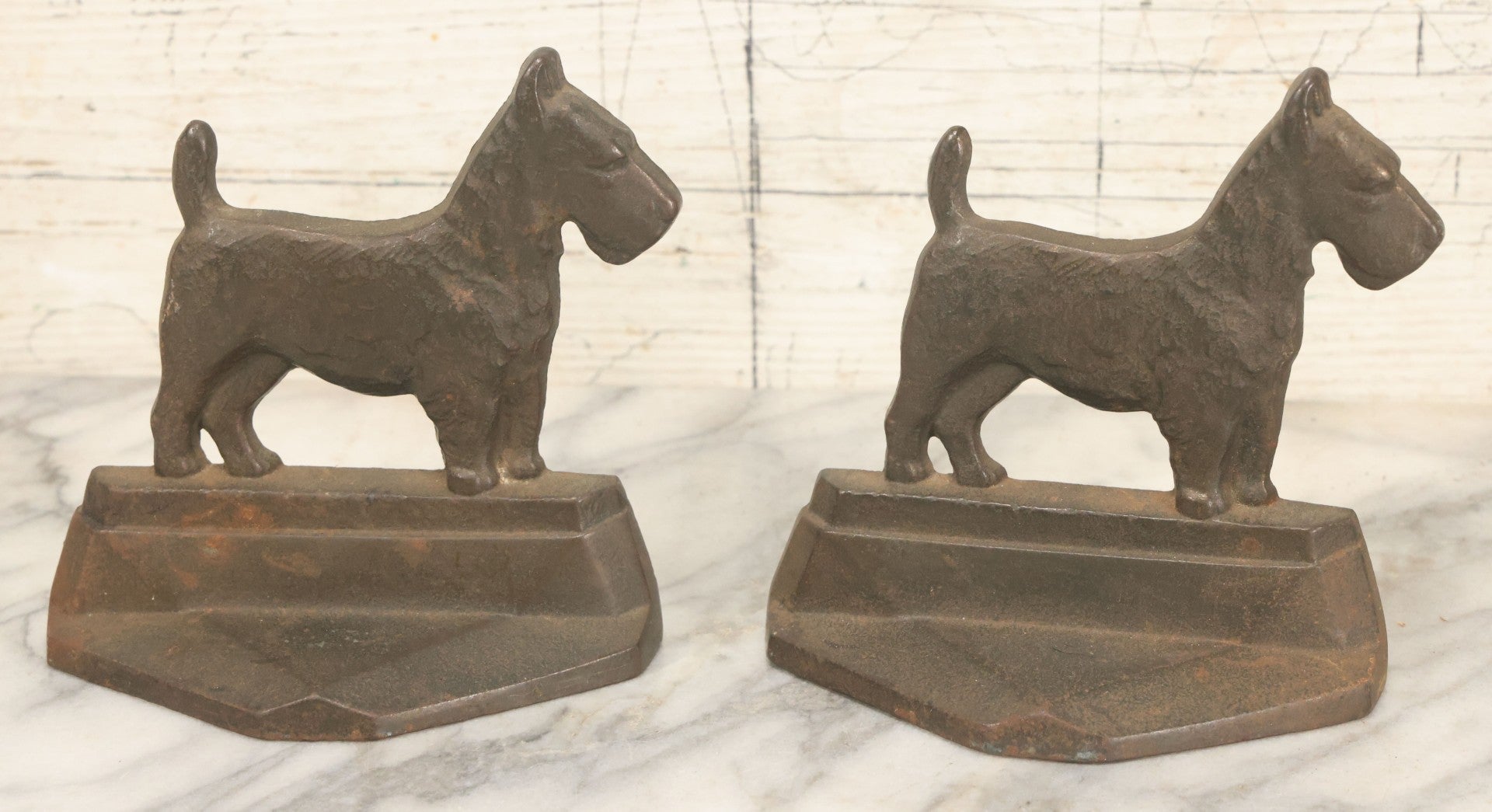 Lot 039 - Pair Of Antique Cast Iron Scottie Dog Bookends, Geometric Design, Aged Finish