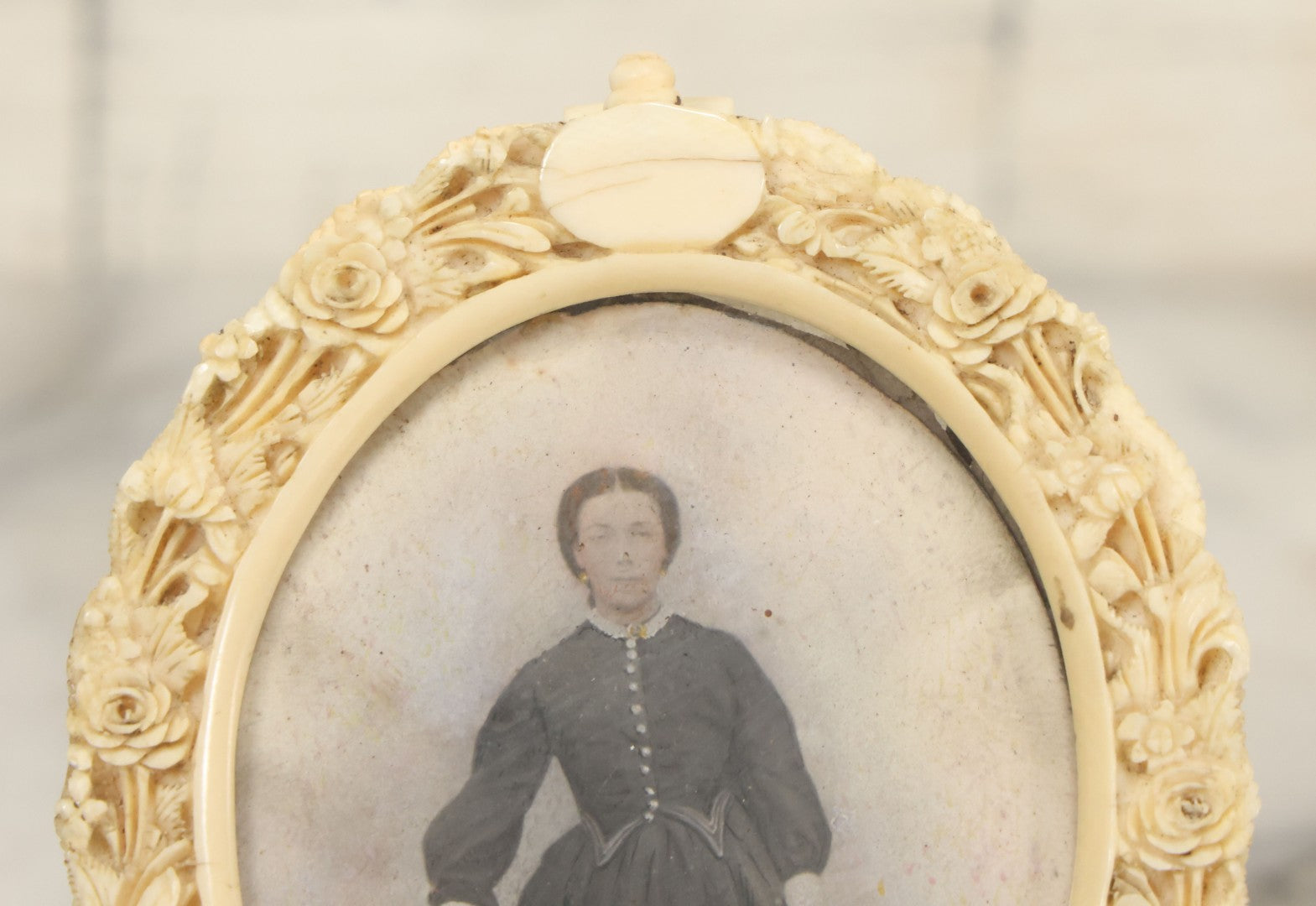Lot 046 - Antique Painted Over Photo Portrait Miniature Of A Woman, Signed Lopez, In Ornate Carved Scrimshaw Bone Floral Frame, Note Repairs