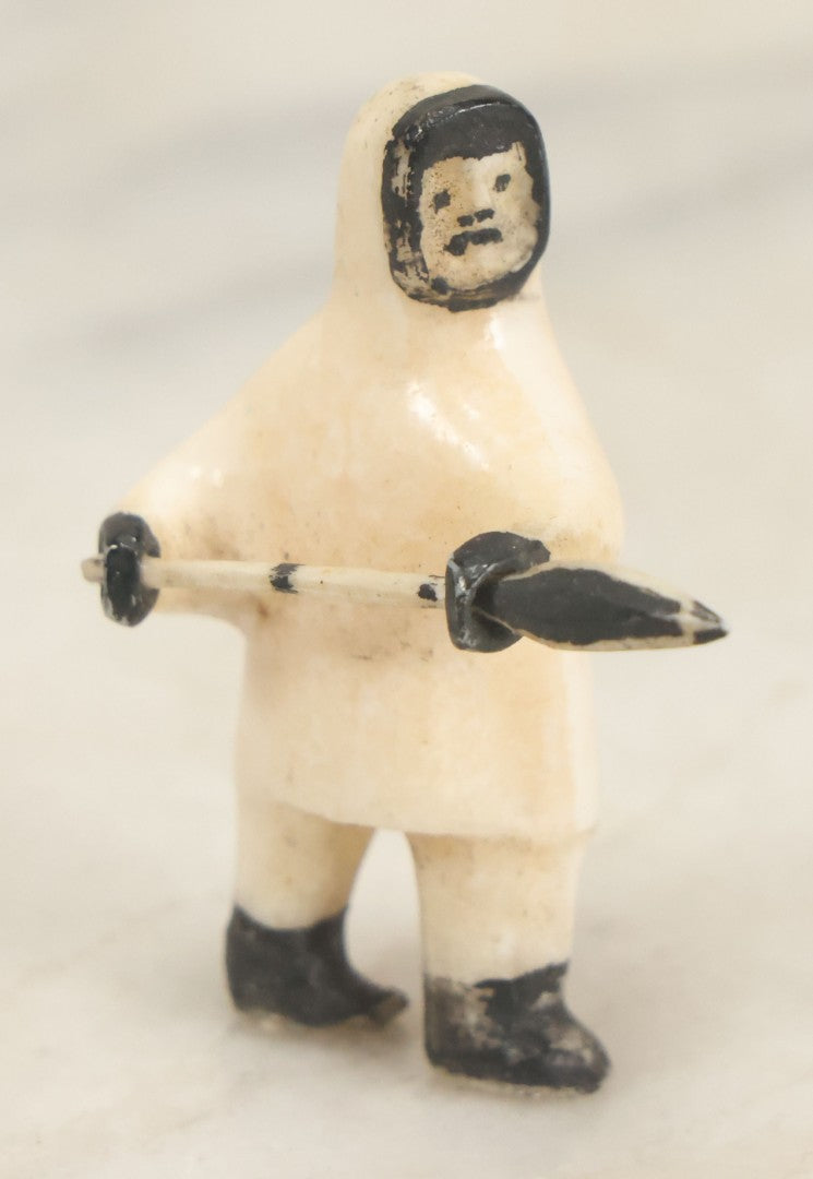Lot 047 - Vintage Inuit Carved Scrimshaw Bone Figurine, Hunter With Spear, Black And White Painted Details